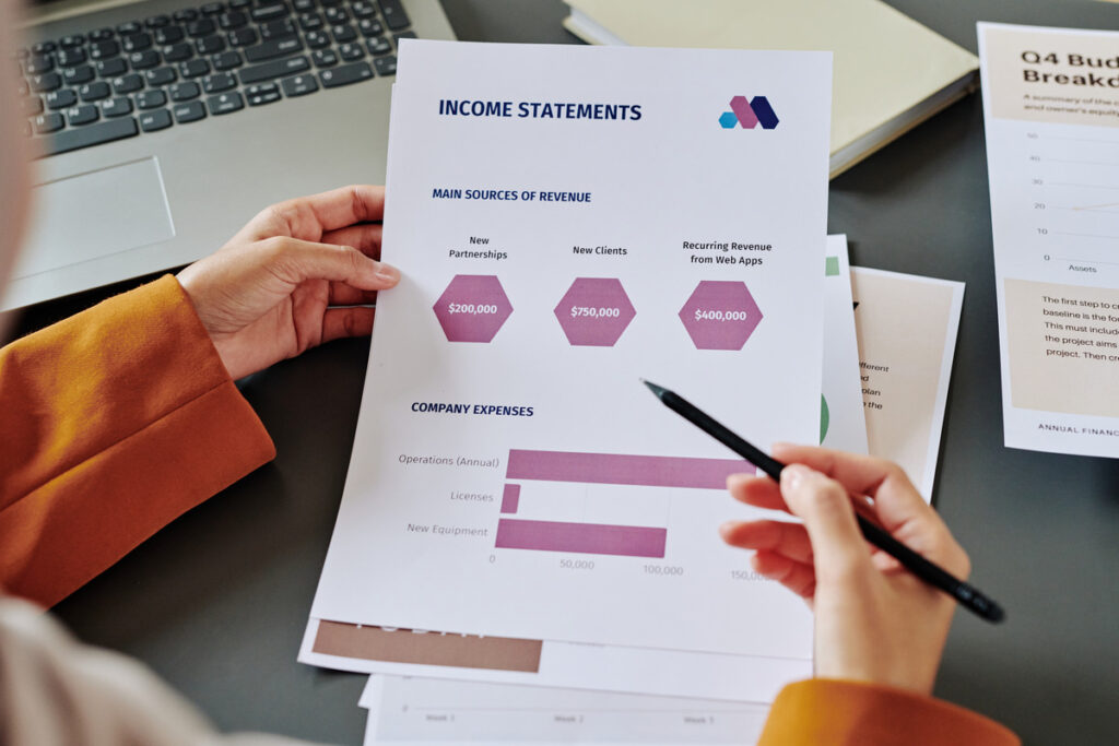 Woman holding an Income Statement.